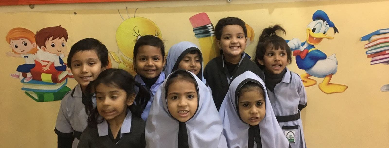 Students with their artwork in class